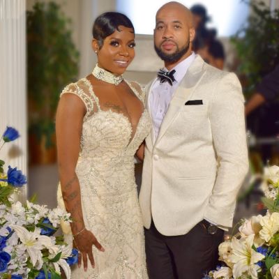 Zion's Mother, Fantasia Taylor, and her husband, Kendall, posing for a photo shoot during their wedding ceremony.
